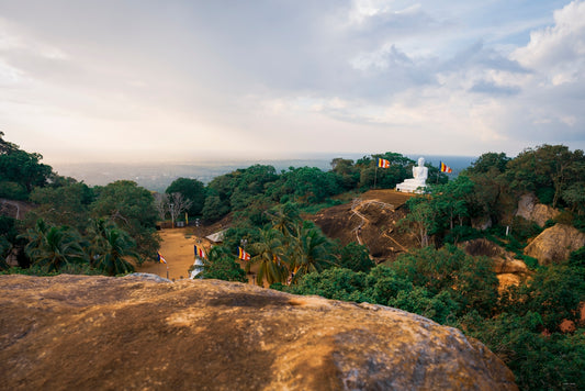 a view of a hill with a statue on top of it