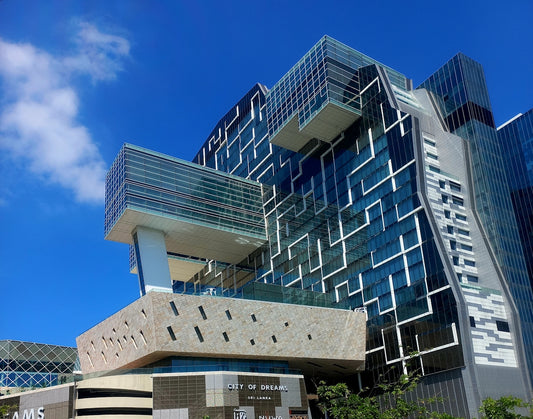 Modern architectural building with geometric patterns on facade.